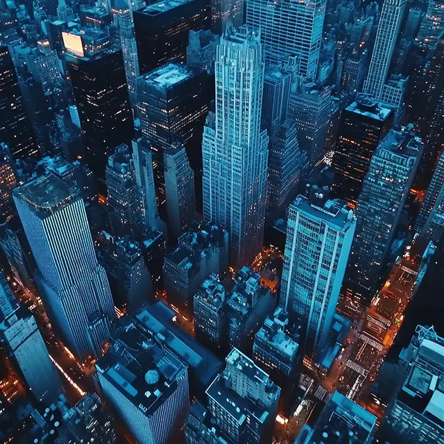 Illuminated skyscrapers in a bustling metropolis at night, symbolising the global reach and earning potential of the HYRYDE Fleet Partnership