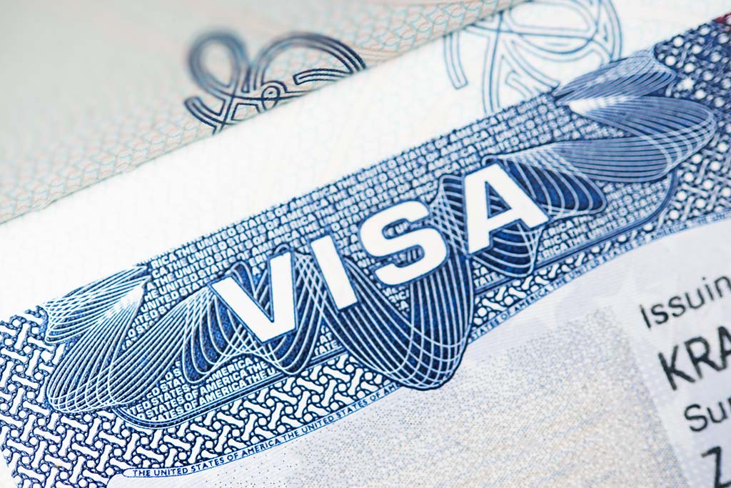 Close-up of a Visa document with the word VISA highlighted in blue.